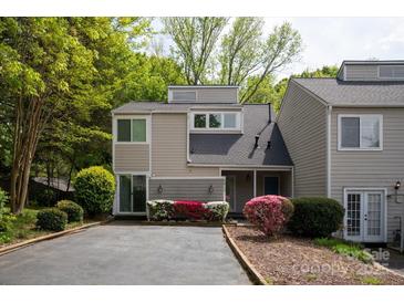 Charming townhouse with beautiful landscaping and neutral exterior at 8412 Cricket Lake Dr, Charlotte, NC 28277