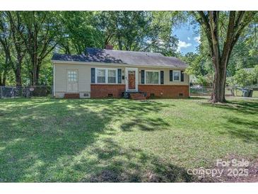 Charming single-story home featuring a brick foundation and a well-maintained front lawn at 1308 Lineberger Ave, Gastonia, NC 28052