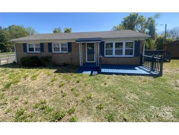 Charming single-story brick home with a blue painted front porch, shutters, and well-maintained landscaping at 131 Mays Ct, Rock Hill, SC 29730