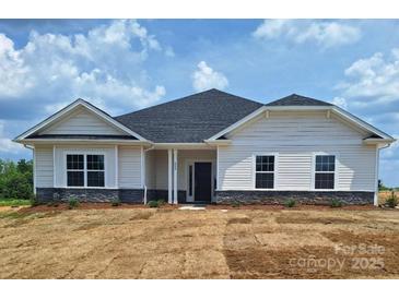 Charming single-story home with white siding and a well-manicured lawn at 228 Mountain Island Dr # 38, Statesville, NC 28677