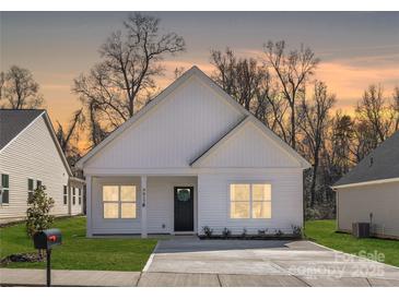 Charming single-story home with a well-maintained lawn and a welcoming front porch at 4827 Victoria Ave, Charlotte, NC 28269