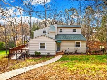 Charming two-story home with a welcoming front yard and a cozy deck, perfect for outdoor relaxation at 32 Heritage Ln, Shelby, NC 28150