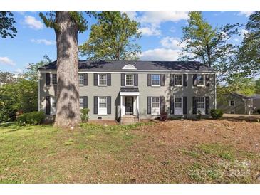 Traditional two-story home featuring gray paint, black shutters, and a well-manicured front lawn at 343 Wakefield Dr # C, Charlotte, NC 28209