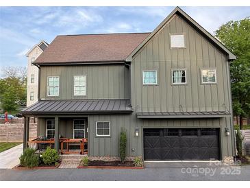 Charming two-story home featuring a two-car garage and inviting front porch at 1511 Landis Ave, Charlotte, NC 28205