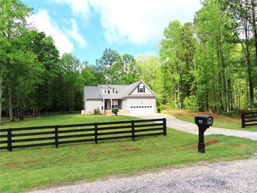 Charming single-Gathering home with well-maintained lawn and attached two-car garage at 2127 Cedar Rd, York, SC 29745