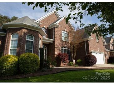 Traditional brick home with manicured lawn and landscaping, showcasing curb appeal at 236 Riley Dr, Taylorsville, NC 28681