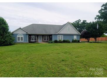 Charming single story home with a well-manicured lawn and inviting front porch at 4330 Goodman Lake Rd, Salisbury, NC 28146