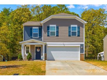 Charming two-story home featuring a front-facing garage, and lovely curb appeal at 320 Silver Oak Cir, Rockwell, NC 28138