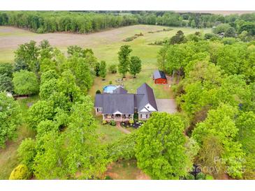Expansive property featuring a house with a pool and lush landscaping at 3871 Cool Branch Dr, Maiden, NC 28650