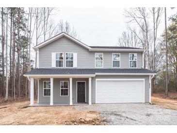 Charming two-story home with gray siding, white trim and a two car garage at 4149 River Run Cir, Hickory, NC 28602