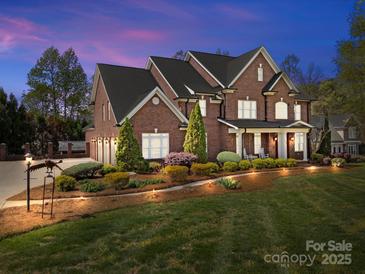 Stunning two-story brick home with a landscaped front yard and a three-car garage at 110 Devonshire Ln, Salisbury, NC 28146
