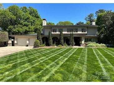 Stunning home with lush, manicured lawn, attached two-car garage, and verdant landscaping at 1816 5Th Nw St, Hickory, NC 28601