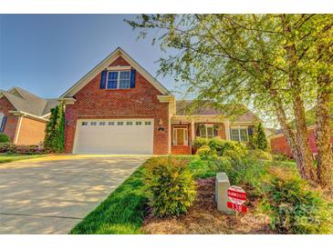 Charming brick home featuring an attached two-car garage and mature landscaping at 138 Victoria Park Dr # 170, Shelby, NC 28150