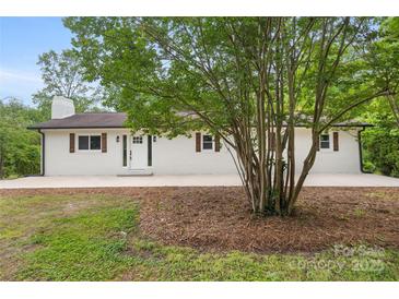 Charming brick home with manicured lawn and walkway leading to the front door at 1904 27Th Avenue Ne Dr, Hickory, NC 28601