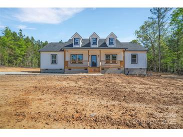 Charming one-story home with board and batten siding and a welcoming porch at 1119 Stanback Rd, Chester, SC 29730