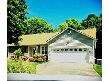 Well maintained, single story home with mature landscaping and two car garage at 317 Robert Keever Rd, Stanley, NC 28164