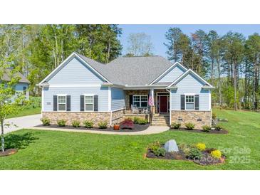 Charming single-story home featuring stone accents and a beautifully landscaped front yard at 4594 N Wynswept Dr, Maiden, NC 28650