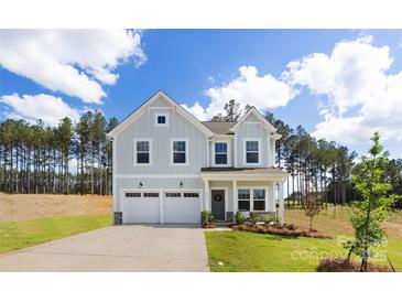 Charming two-story home with a two car garage, manicured lawn and lovely landscaping at 9913 Jack Nicklaus Dr # 908, Lancaster, SC 29720