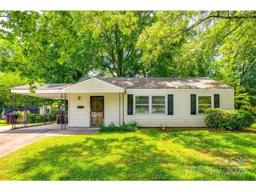 Charming single-story home featuring a covered carport and a well-maintained front lawn with mature trees at 1430 Bose Ave, Rock Hill, SC 29732