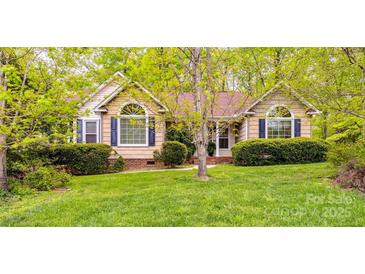 Charming single-story home with manicured lawn and mature trees enhancing curb appeal at 2199 Lookout Pt, Rock Hill, SC 29732