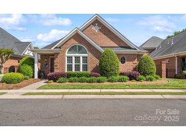 Charming brick home with manicured landscaping, decorative windows, and inviting curb appeal at 962 Blakeley Walk, Rock Hill, SC 29732