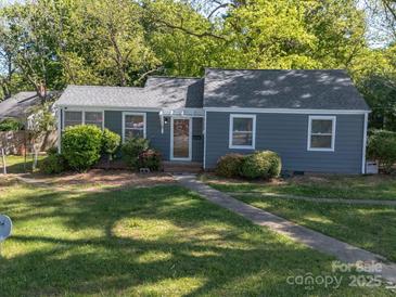 Charming single-story home with a well-manicured lawn and inviting front entrance at 1142 Mona Dr, Charlotte, NC 28206