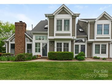 Charming two-story home with manicured lawn and inviting curb appeal at 8251 Tradd Ct, Charlotte, NC 28210