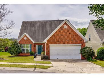 Charming single-story brick home with a manicured lawn and a two-car garage at 269 Tradition Way, Rock Hill, SC 29732