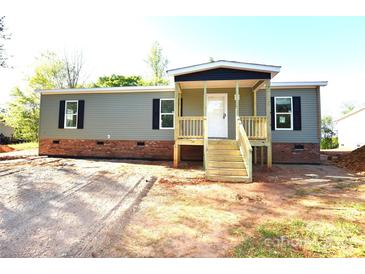 Charming single story home featuring a welcoming porch and a classic color scheme at 828 Long Bow Rd, Salisbury, NC 28144