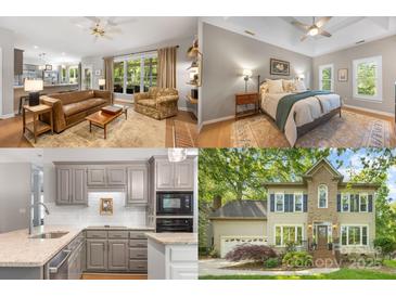 Inviting living room with hardwood floors and a leather sofa, leading to the kitchen at 110 River Wood Dr, Fort Mill, SC 29715