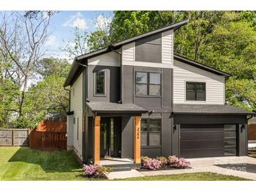 Modern two-story home with a black-and-white exterior and a well-maintained front yard at 3256 Brixton Ct, Charlotte, NC 28205
