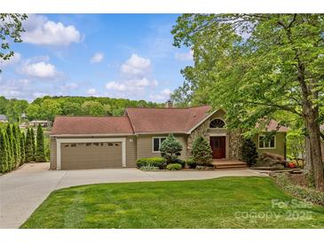 Charming home featuring a manicured lawn, stone accents, and a two-car garage at 376 Oak Tree Rd # 37, Mooresville, NC 28117