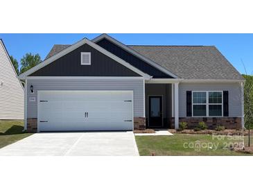 Charming single-Gathering home with a two-car garage and well-maintained lawn in a suburban neighborhood at 1550 Doran Ter, Richburg, SC 29729