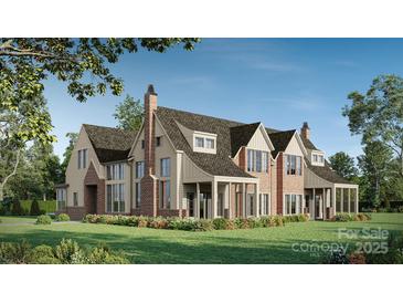 Stunning brick and siding home showcasing a manicured lawn and charming architectural details at 1636 Ferncliff Rd, Charlotte, NC 28211