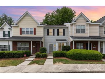 Charming townhomes featuring well-maintained landscaping, sidewalks, and inviting curb appeal at 1766 Forest Side Ln, Charlotte, NC 28213