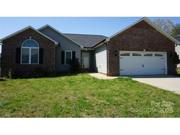 Charming single-story home featuring a brick facade, gray siding, and a well-maintained front yard at 4193 He Propst Rd, Maiden, NC 28650