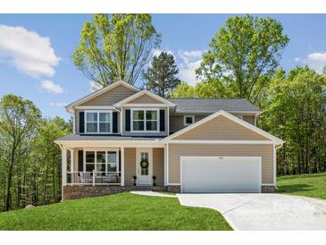 Beautiful two-story home with a front porch and well-maintained lawn at 1112 Allman Ext, Mount Pleasant, NC 28124