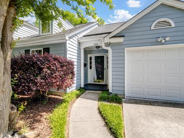 Charming home exterior with blue siding, well-maintained landscaping, and a welcoming front entrance at 1506 Crestdale Rd, Rock Hill, SC 29732