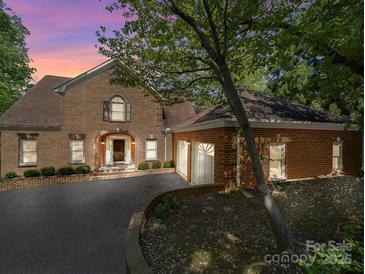 Beautiful brick home with a two-car garage and a spacious driveway at 209 Tinkham Trl, Cramerton, NC 28032