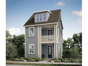 Charming two-story home featuring a covered porch, balcony, and beautifully landscaped front yard at 237 Davidson Gateway Dr, Davidson, NC 28036