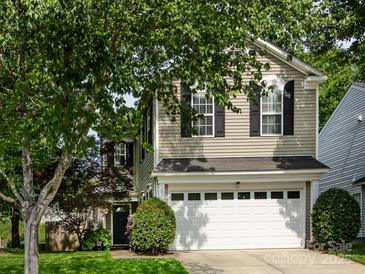 Charming two-story home with a two-car garage and mature trees at 5304 Silabert Ave, Charlotte, NC 28205
