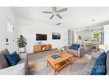 Bright living room featuring modern decor, stylish furnishings, and an open concept layout at 3056 Goble St, Gastonia, NC 28056