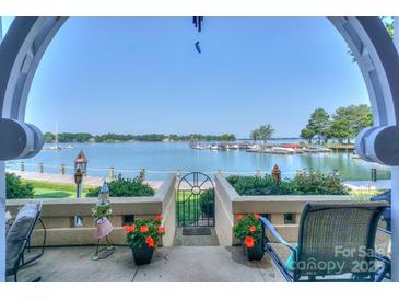Expansive lake view from the outdoor patio, showcasing waterfront living and serene scenery at 867 Southwest Dr, Davidson, NC 28036