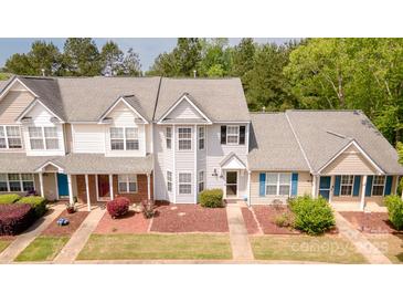 Charming townhome with well-maintained landscaping and a welcoming facade at 1032 Eagles Nest Ln, Indian Land, SC 29707
