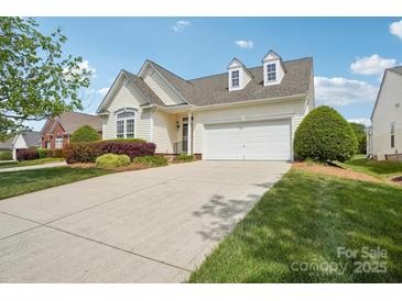 Charming home featuring a two-car garage, dormer windows, and a well-manicured front lawn at 117 Pine Lake Dr, Monroe, NC 28110