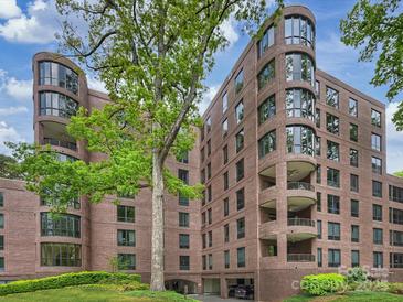 Elegant brick condo building features curved windows and underground parking at 916 Cherokee Rd, Charlotte, NC 28207