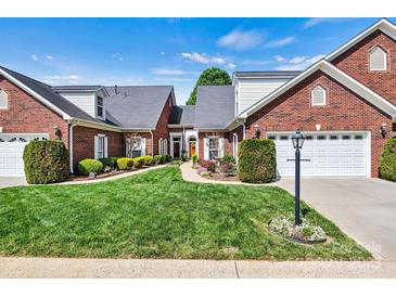 Charming brick home featuring manicured lawn and lush landscaping with a two-car garage and inviting entryway at 1119 21St Ne Ave, Hickory, NC 28601