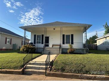 Charming single-Gathering home featuring a welcoming front porch and well-maintained lawn at 36 Maple Ave, Gastonia, NC 28054