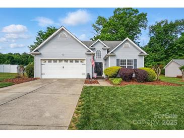 Charming single-Gathering home featuring a two-car garage, well-maintained lawn, and traditional siding at 503 Azure Ave, Albemarle, NC 28001