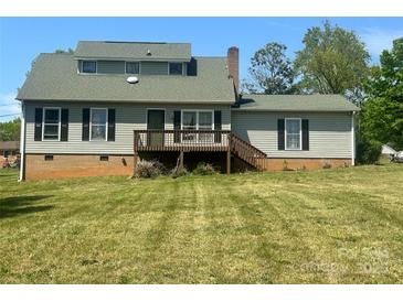 Charming home with a deck and a spacious backyard, perfect for outdoor entertaining at 109 Terrace Pl, Lincolnton, NC 28092
